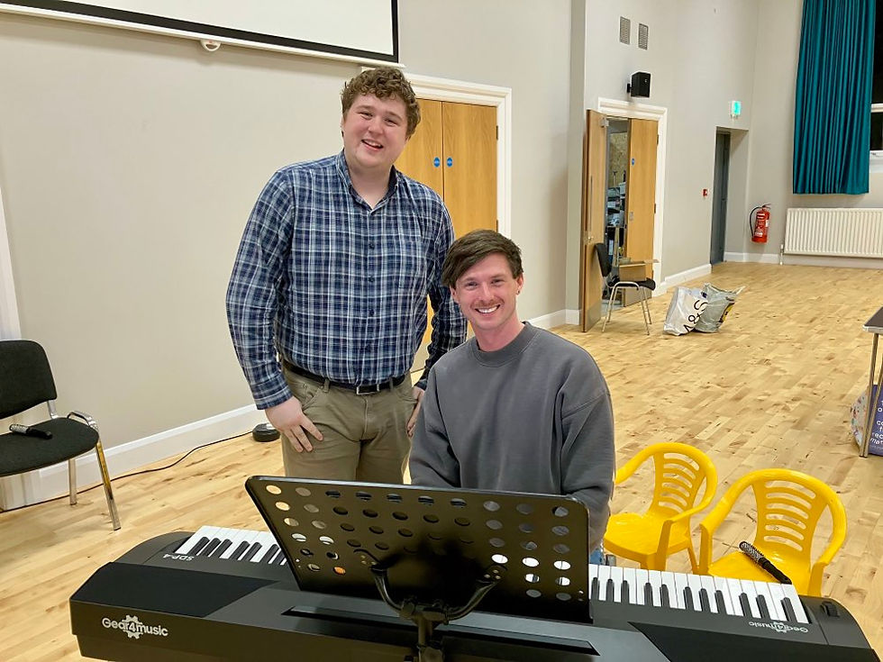 Patrick Connor (standing) with Musical Director Andrew Robinson.