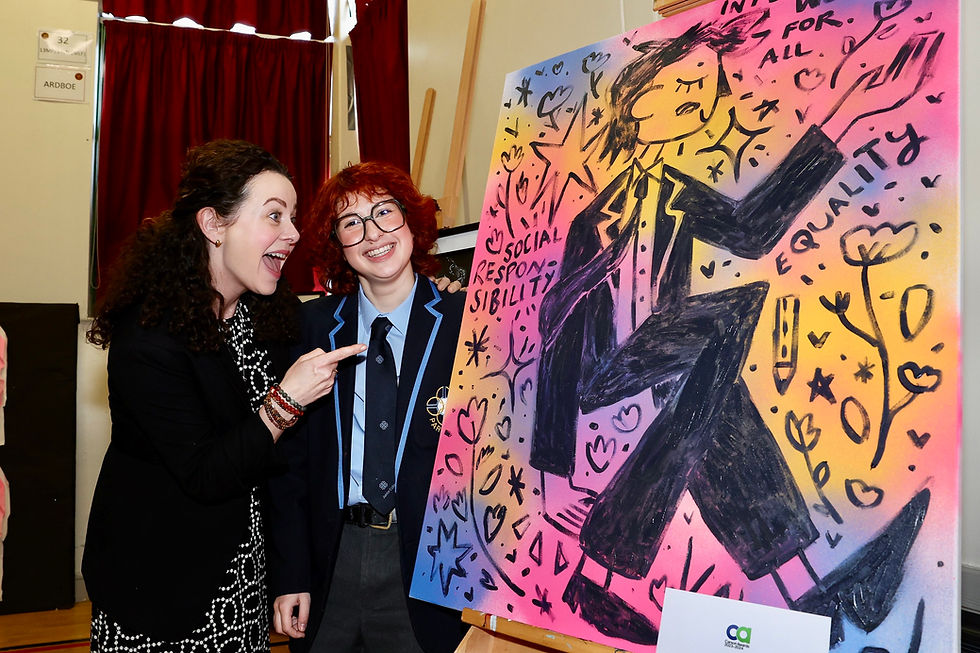 Student from Parkhall IC showing Geraldine Hughes their winning artwork.