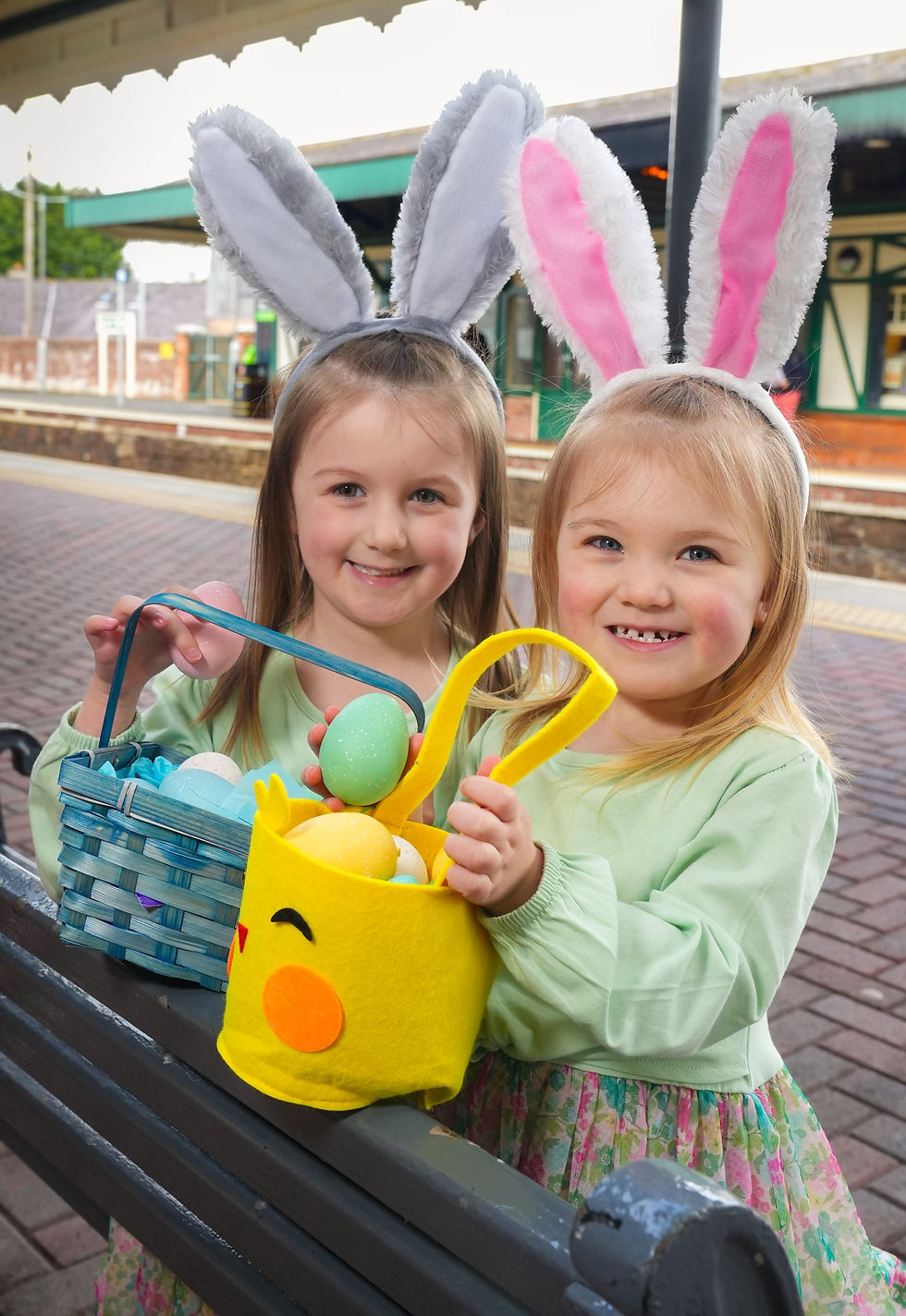 Sisters Lacie & Abbie pictured at Antrim train station getting easter ready.