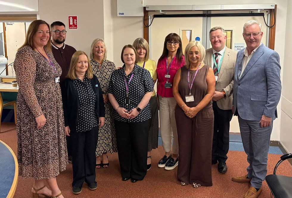 Health Minister Mike Nesbitt and Professor Mark Taylor with the Belfast Trust Validation Team 