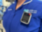 Nurse wearing body worn camera on blue uniform