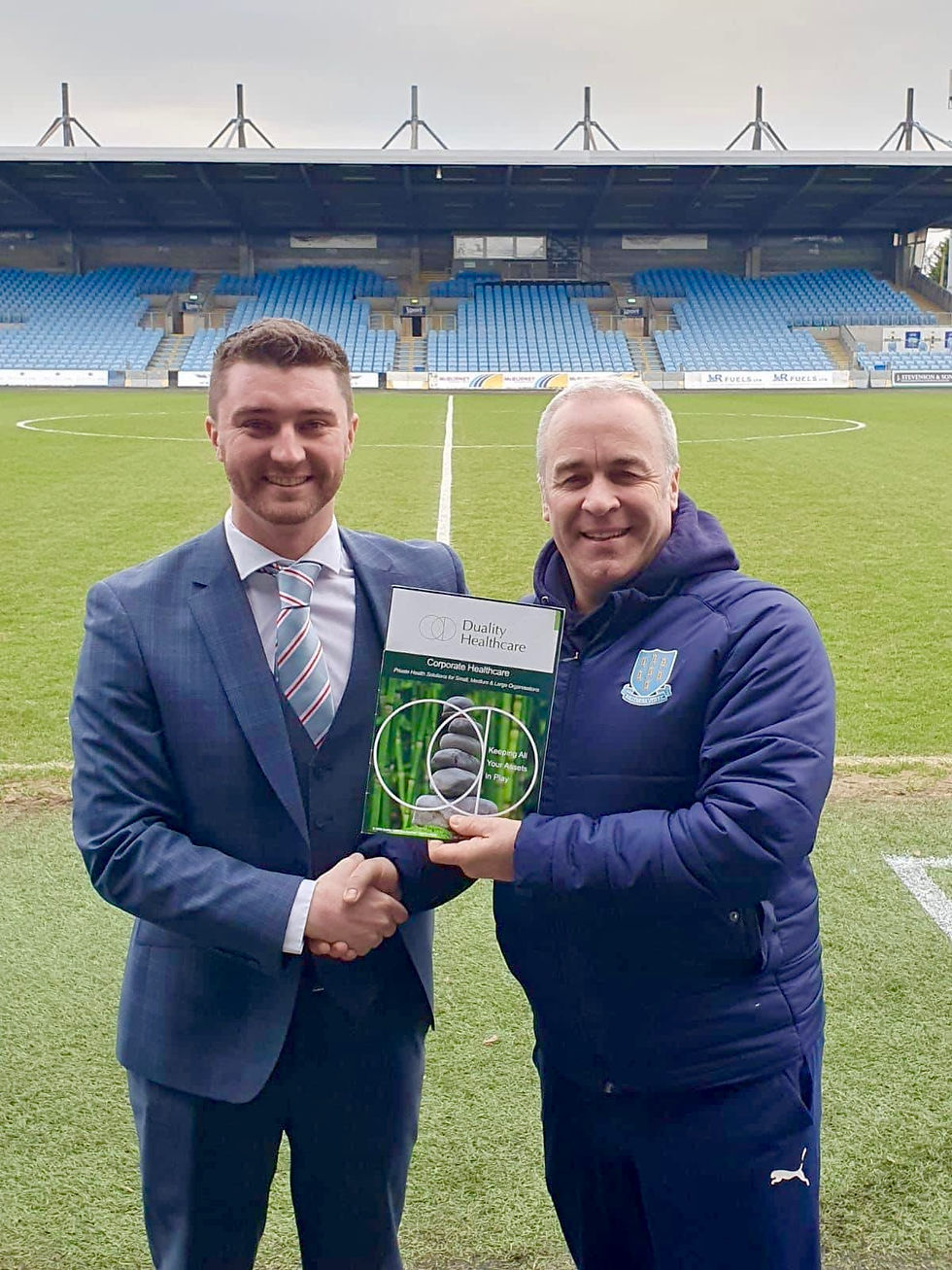 Dr Craig Wylie (Lead General Practitioner of Duality Healthcare Galgorm) pictured with Ballymena United FC Chairman, Chris Selwood