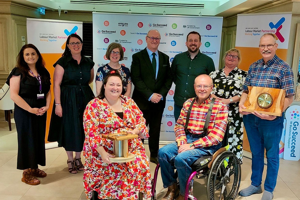 Back Row L-R: Laura Murphy-Sloan Adapt NI, Rhonda Lynn MEABC, Julie Bonar Make the Call, Norman Sterritt NIUSE, James McCann Advice NI, Eileen Traynor DfC, Ed McAuley Ed’s Woodturning and Crafts Front Row L-R: Katie Matthews-Furphy the Mind Tribe UK, Michael Holden MBE Accessoloo