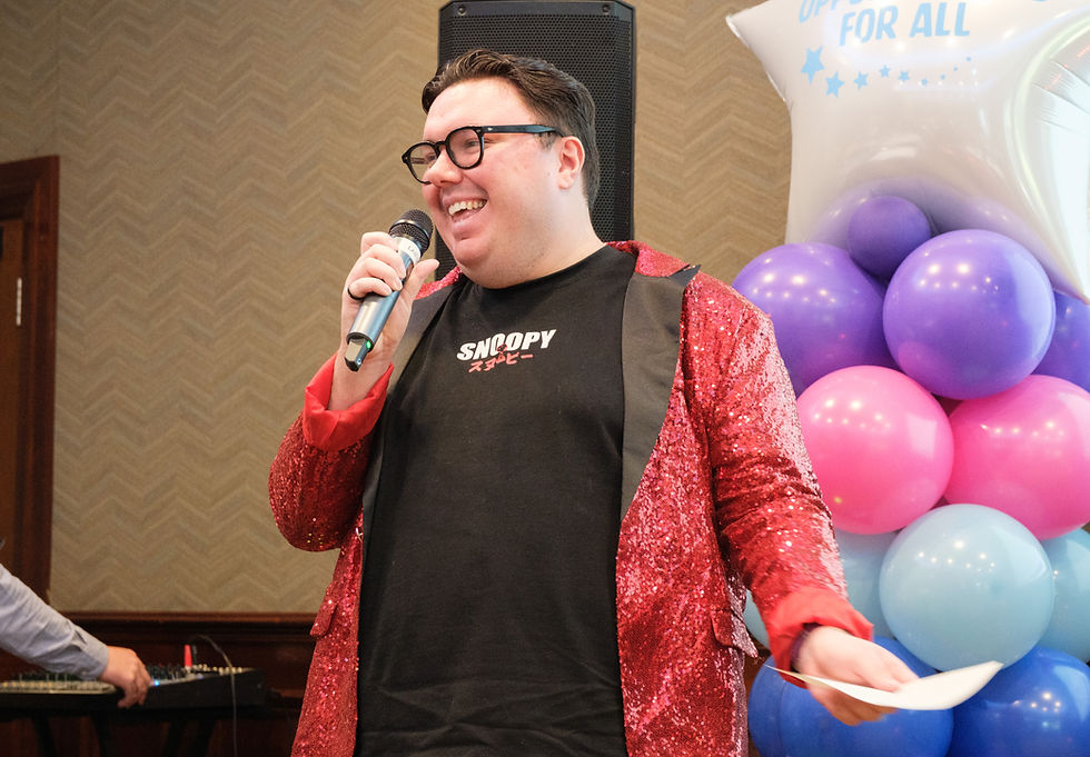 Service user Mason Kerr performing at a celebration event marking 20 years of Day Opportunities in the Northern Trust.