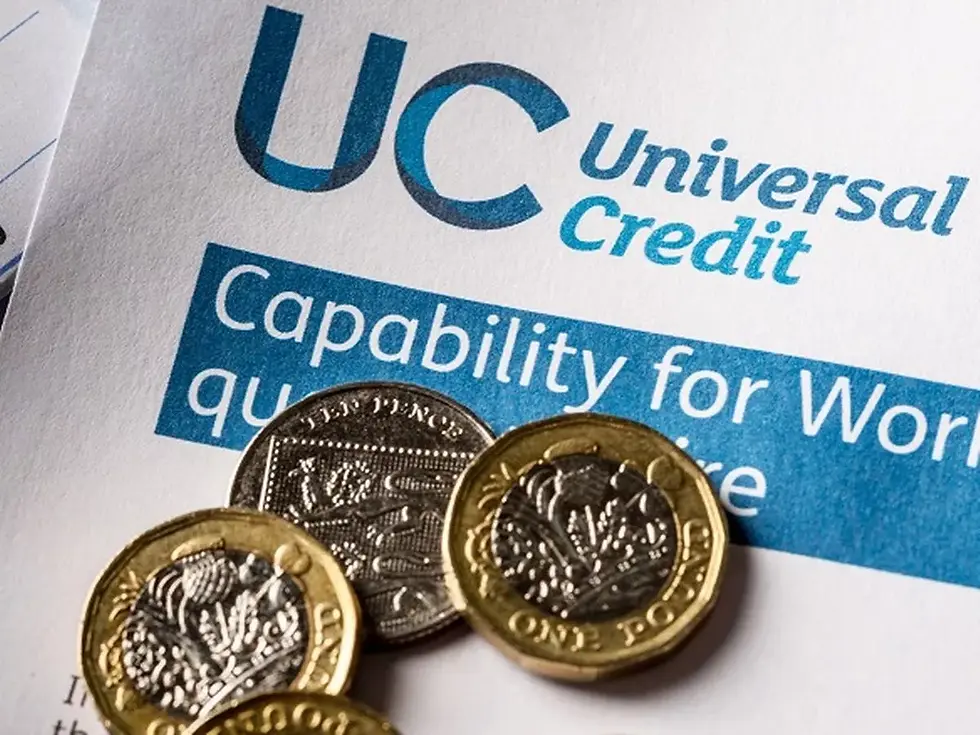 Universal Credit application form with money coins