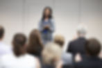 female leader giving speech to her company about the importance of employer branding