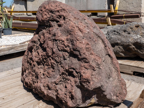 Large red lava rock boulder