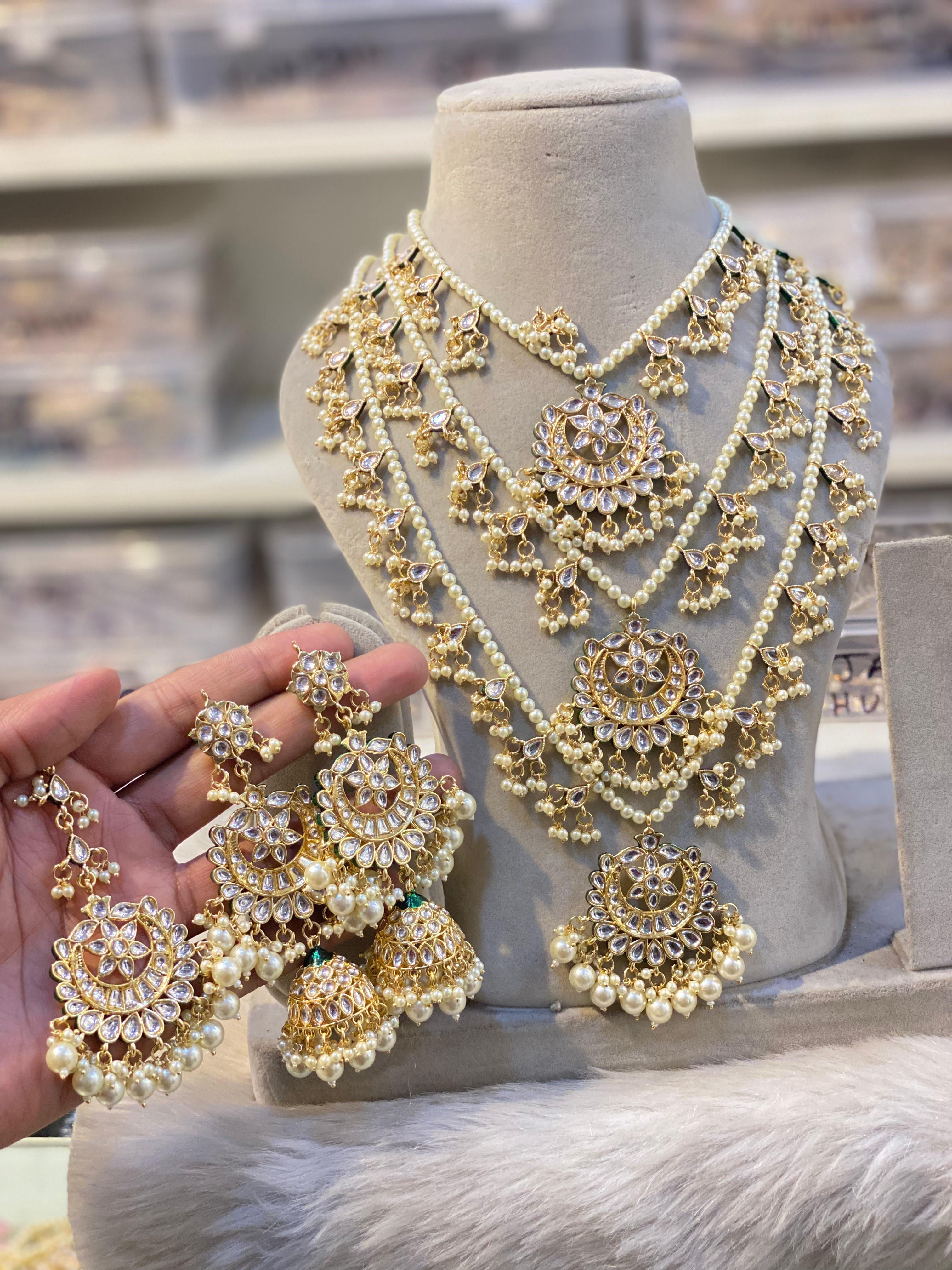 Hira Collections 
Traditional Kundan 
Triple Layer Raani Haar + Jhumka Earrings 