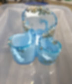 Personalized custom designs in blue resin with gold flakes.