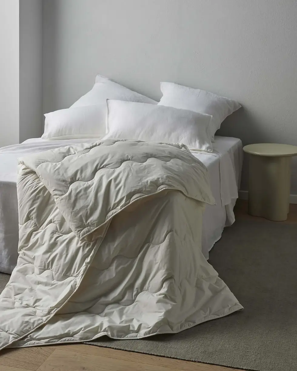 Thumbnail: Weave Home Wool Inner on a bed