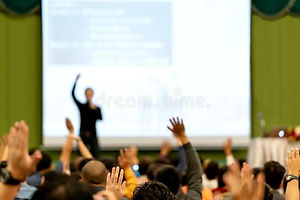 blurred-rear-view-audience-conference-hall-seminar-room-speaker-brainstorming-motivational