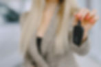 woman holding car key fob