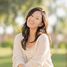 Kelley, marriage and family therapist at Behold Counseling, smiling outdoors in warm light