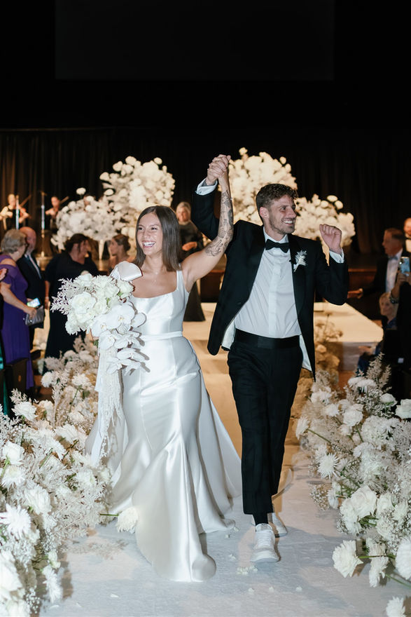white roses orchids and hydrangeas for wedding church ceremony