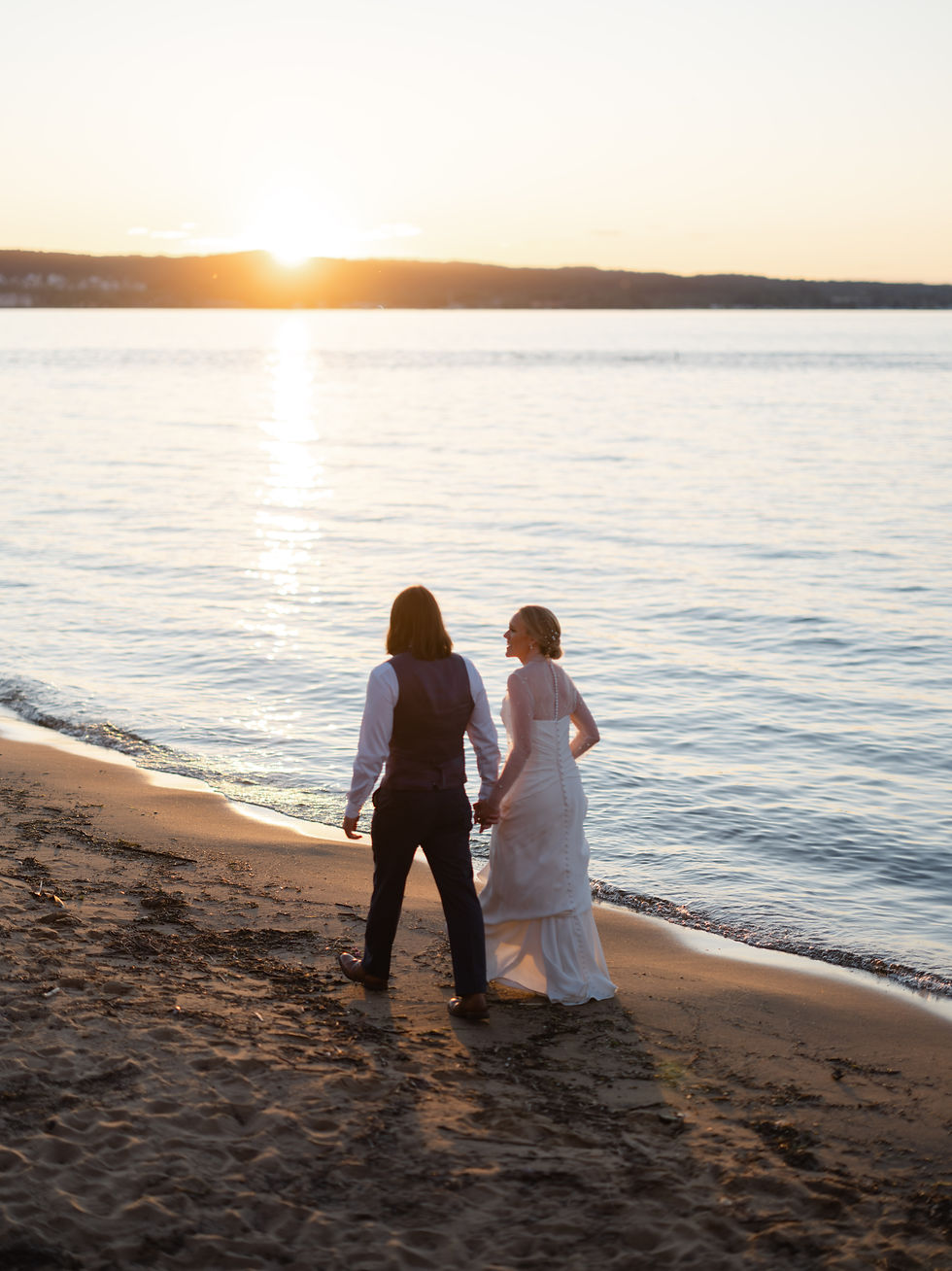 bride and groom on the shores of lake michigan at their wedding at Delamar