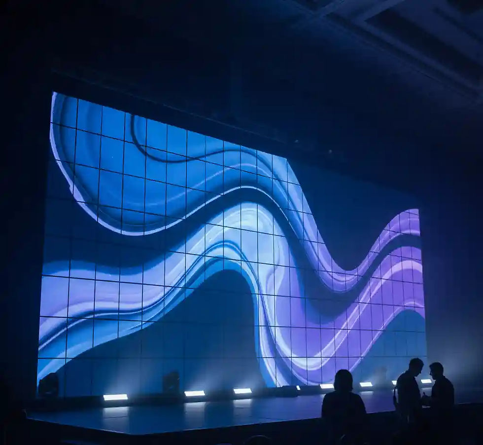 A large LED video wall display with glowing blue and purple wave patterns, demonstrating seamless modular panels in an event setting with silhouettes of people in the foreground.