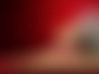 Classic movie popcorn in a striped bucket with film reel, representing movie night and cinema entertainment.