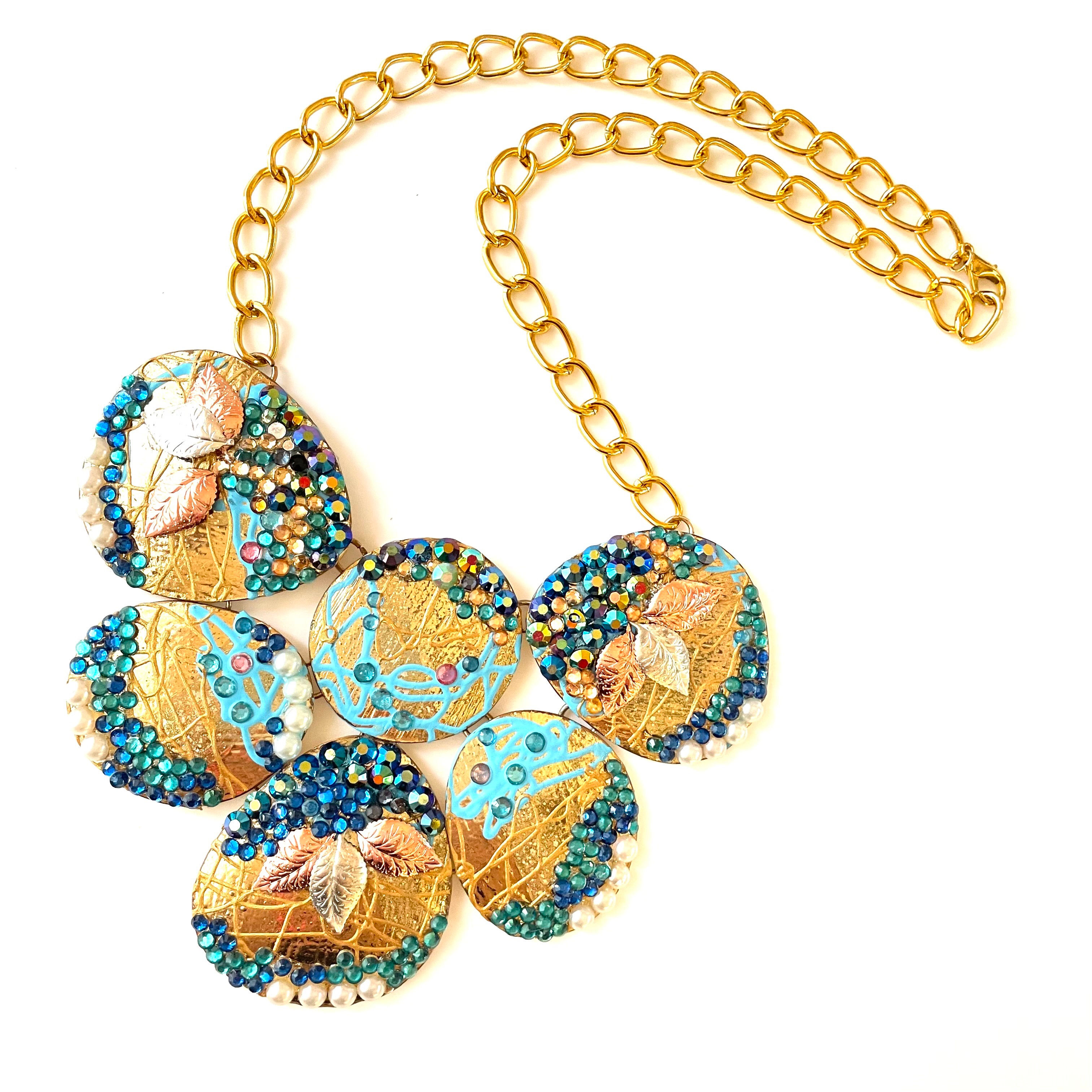 Gold Plated Necklace with blue and green Crystals, details of paint
