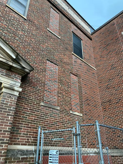 Outdated windows and deteriorating exterior brick at Whitefish Bay Middle School.