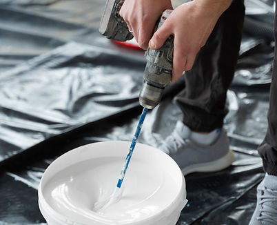 hands-mixing-paing-with-drill.jpg