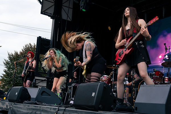 Hair flip action shot Sam and full band.jpg