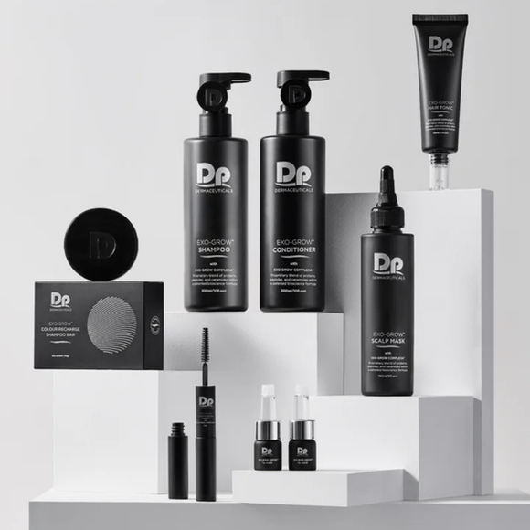 Black cosmetic products on white display blocks.