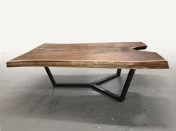 Live edge coffee table shown with steel union base with a live edge walnut wood slab, natural tree slice.
