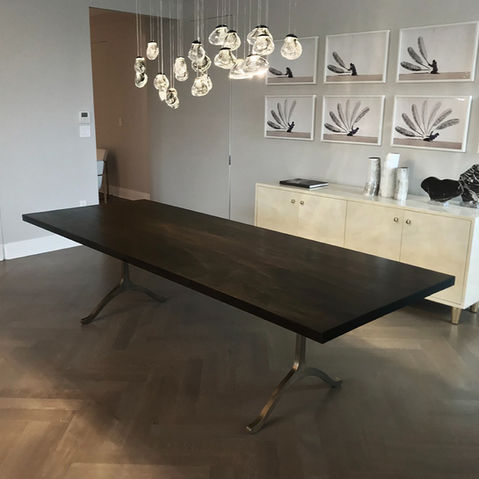Solid oxidized walnut wood table with antiqued brass wishbone legs. Custom made high end modern furniture.