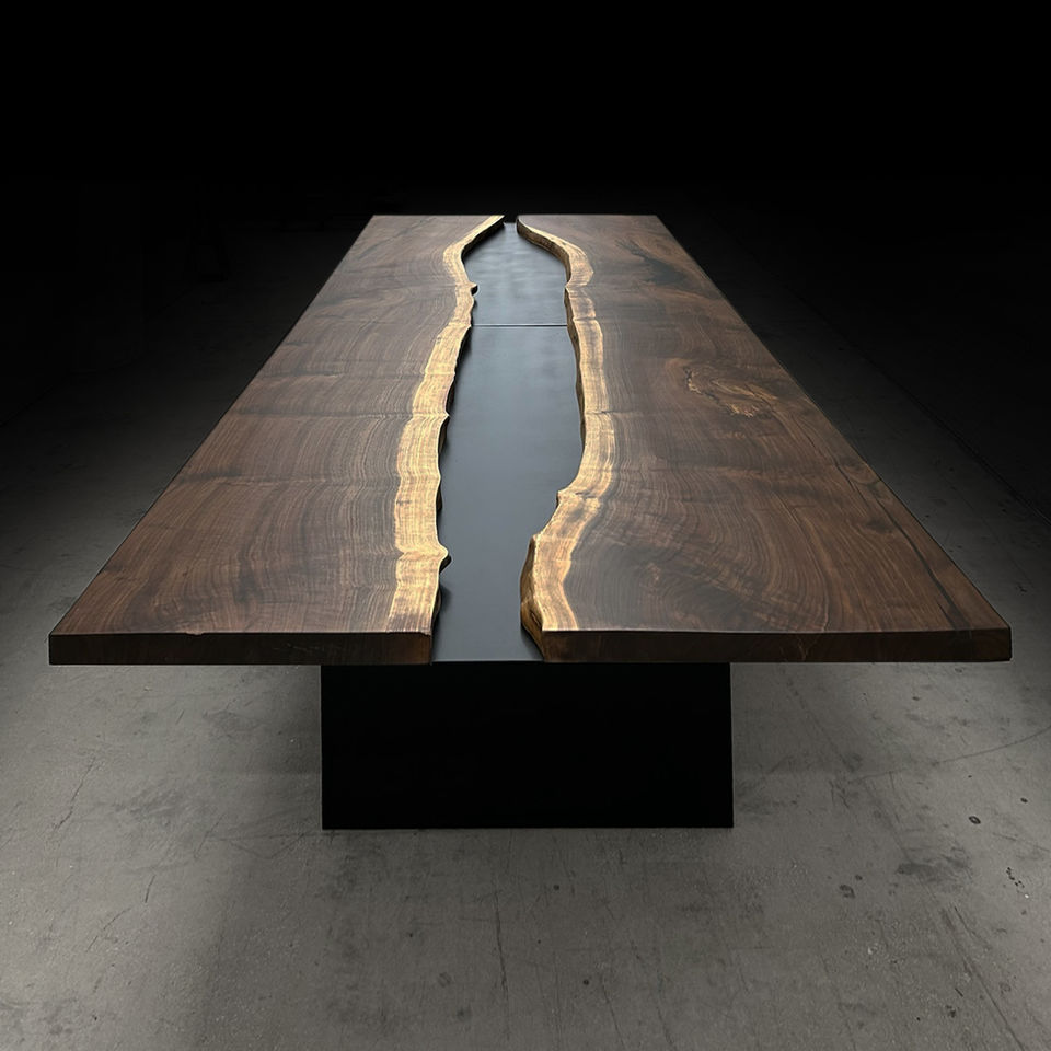 River conference tables feature live edge wood slabs down the center to create a flowing, river-like centerpiece. Each table is handcrafted to showcase natural grain, striking contrast, and seamless craftsmanship — with seamlessly integrated power, data, and wire management built directly into the design — perfect for boardrooms and executive spaces that demand a bold, one-of-a-kind statement piece.