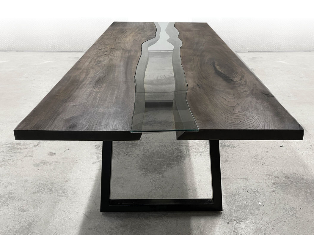 Live edge river dining table shown with steel base on a live edge walnut wood slab.
