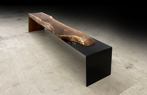 Live edge bech shown with steel overflow base and with a live edge walnut wood slab, natural tree slice.