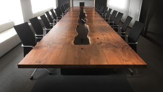 River conference tables feature live edge wood slabs down the center to create a flowing, river-like centerpiece. Each table is handcrafted to showcase natural grain, striking contrast, and seamless craftsmanship — with seamlessly integrated power, data, and wire management built directly into the design — perfect for boardrooms and executive spaces that demand a bold, one-of-a-kind statement piece.