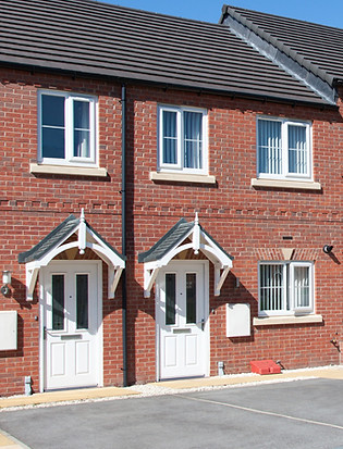 UPVC White Front Doors On Brick Terrace Houses