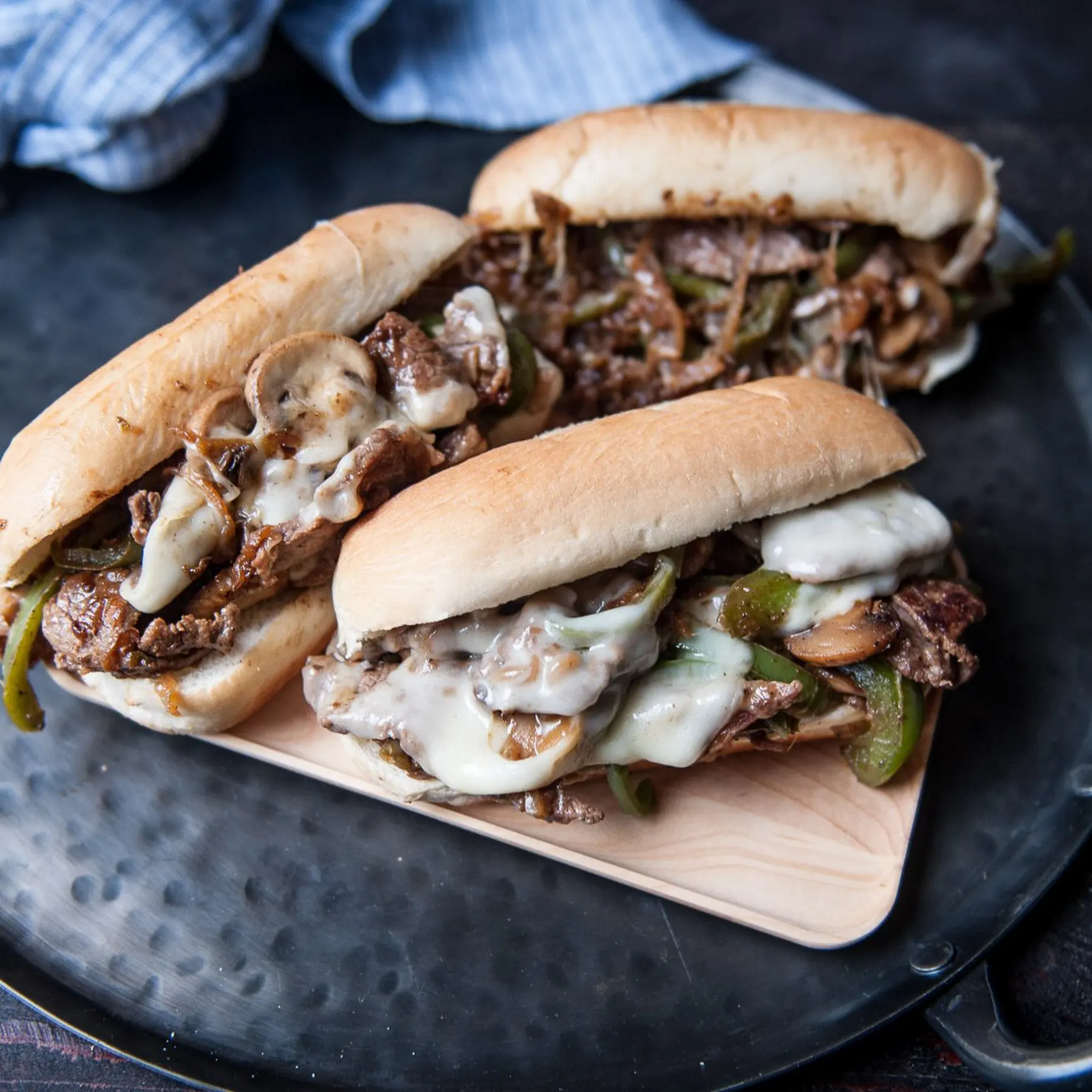 Double Philly cheesesteaks loaded with beef, mushrooms, and cheese, served by Always Fresh BBQ Catering at corporate events, private celebrations, and birthday parties.