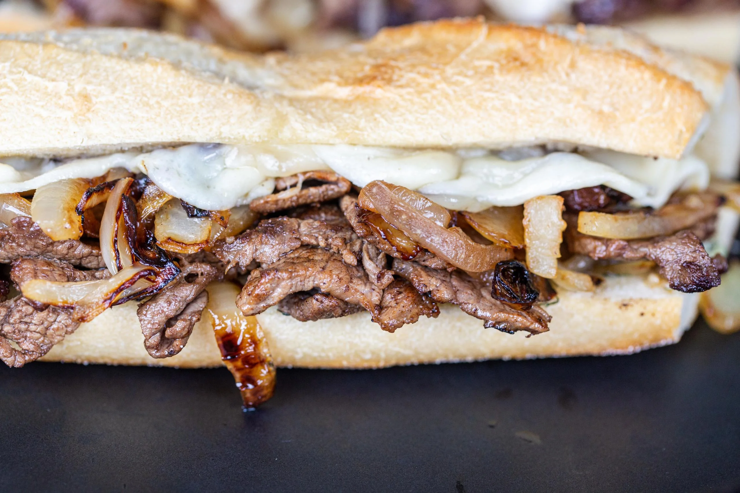 Grilled Philly cheesesteak stuffed by Always Fresh BBQ Catering for corporate lunches, birthday parties, and private BBQ events.