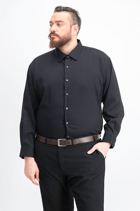 Hadi wearing a formal attire, all black, hand inside his pocket