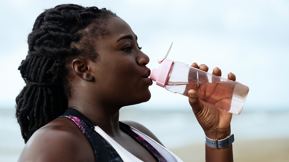 a runner stopping to drink water during a long run
