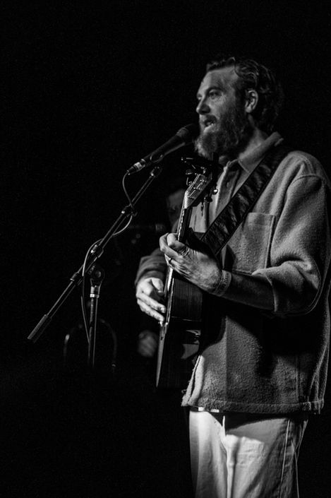 John Mark McMillan playing guitar and singing