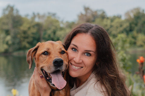 Brown Dog with a dark haired women