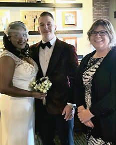 Bride and groom with wedding officiant