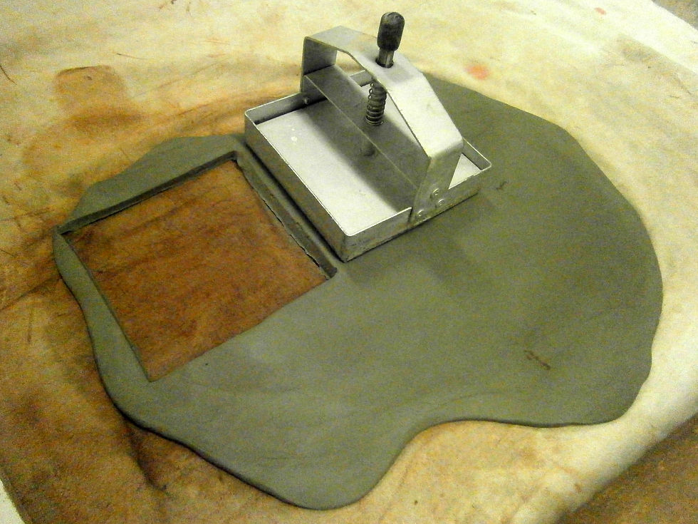 Using the tile cutter on clay slab