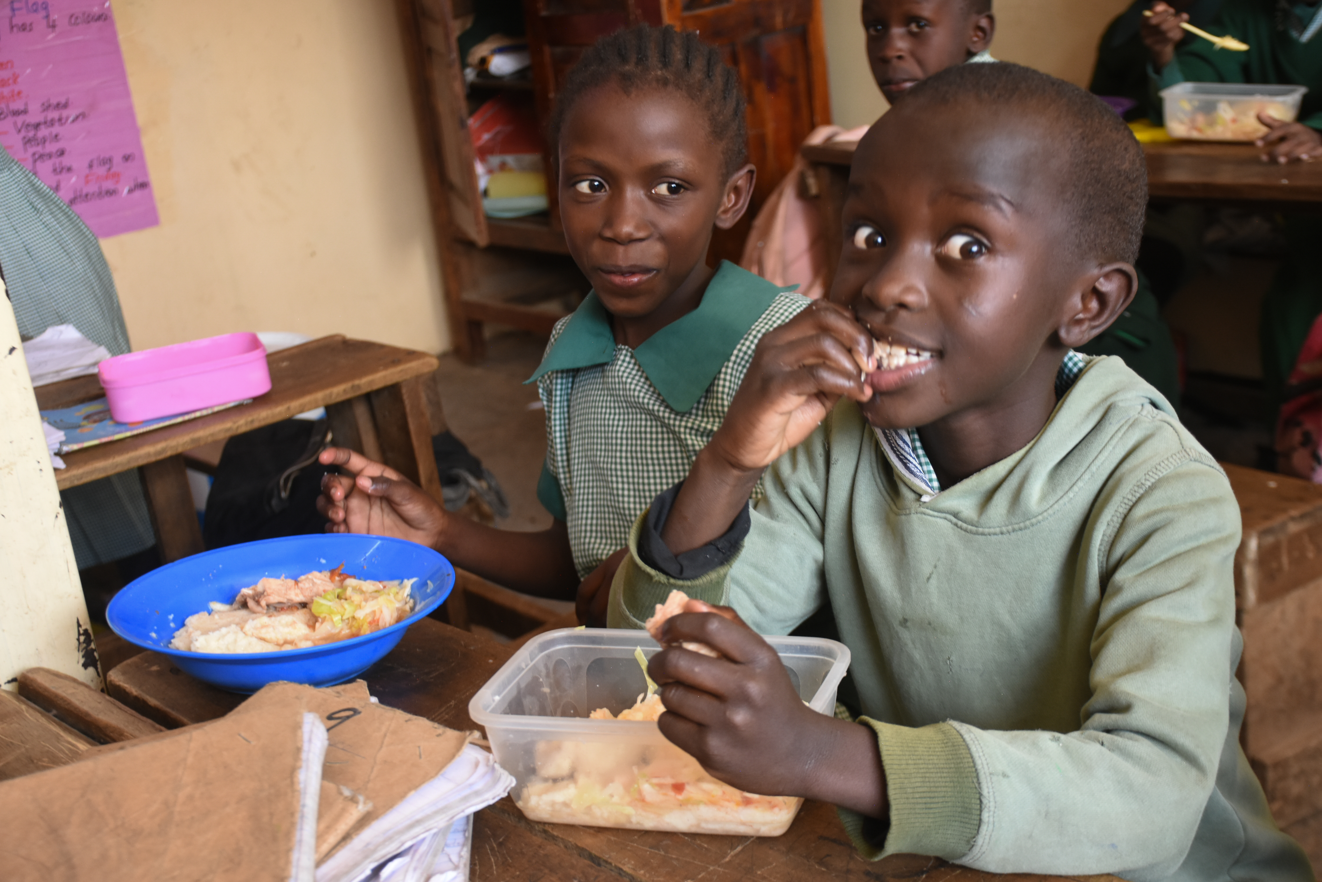 Children sharing a meal at BlueHouse Mission