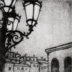 Drypoint print in black in k of a scene in Florence— apartments in the distance, and an ornate street pole lit up against a darkling sky