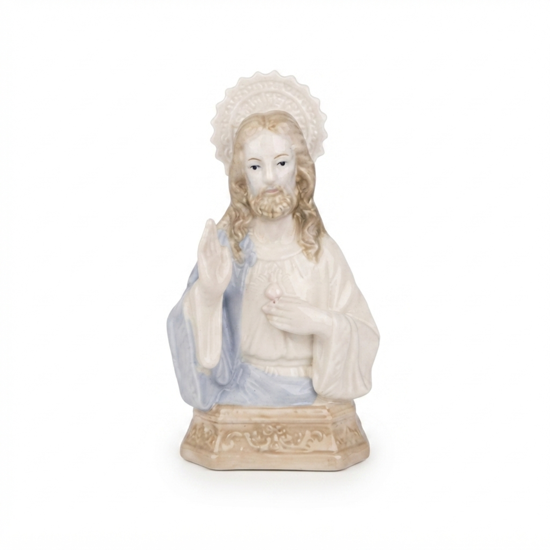 Imagem do Sagrado Coração de Jesus em porcelana com tamanho de 22 x 14 x 9 cm.