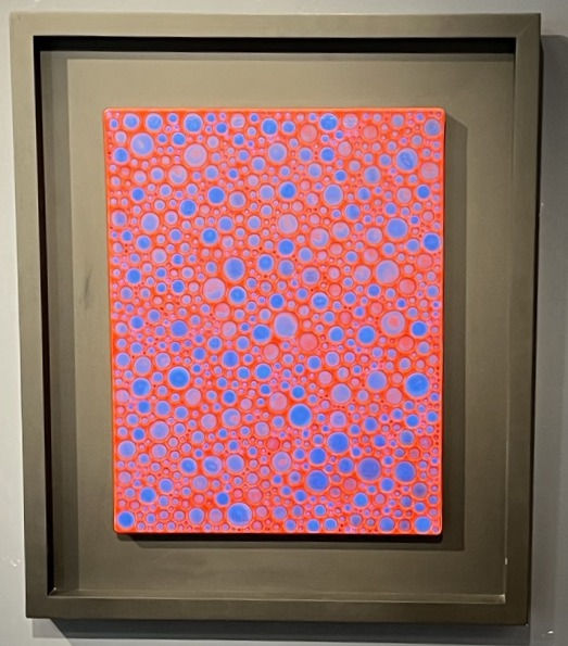 Framed artwork with a vibrant pattern of pink and purple circles on a red background. Set against a plain dark frame and wall.
YAYOI KUSAMA (b. 1929)
Dots-Obsession
Acrylic on canvas
41 × 32 cm (16 ½ × 12% inches)
Signed, title and dated 2005.