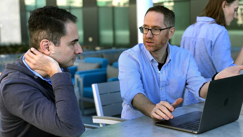 Jim talking with Ruzuku Co-founder Abe Crystal about a project