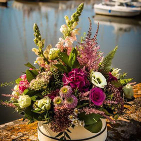 Colourful posy flower arrangement on wall