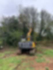 Excavator working on maintaining property