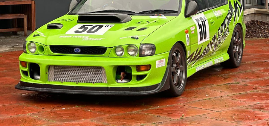 A green rally car