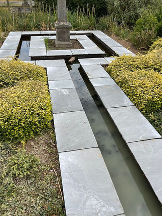 Water feature with paved sides